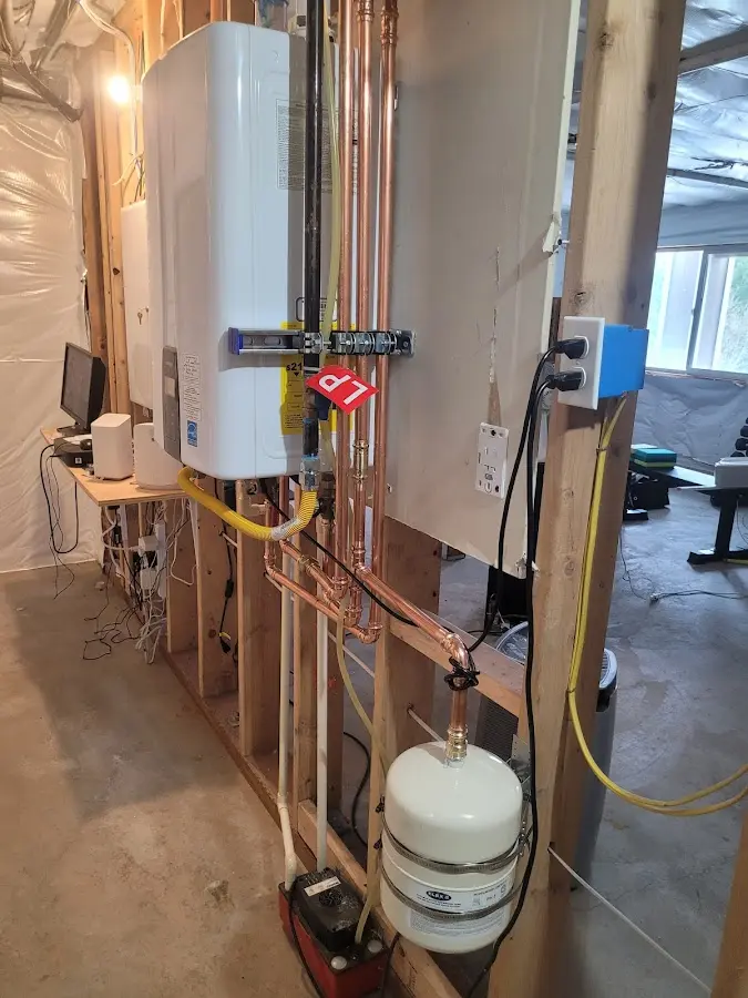Licensed plumber repairing a kitchen sink in Sandy